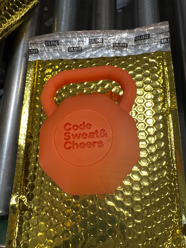 Photo 1 of NIKE Orange Plastic Kettlebell for Decor 