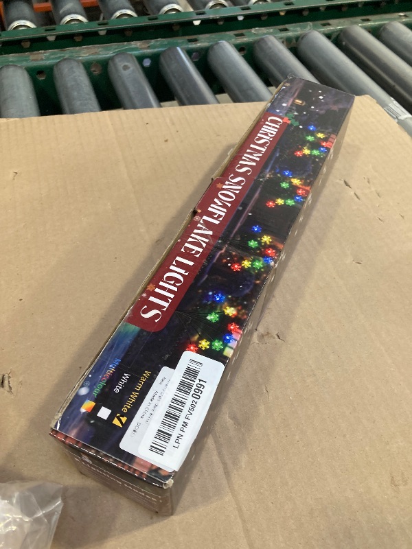 Photo 1 of Newhale Set of 4 Snowflake Solar Christmas Decorations, 8 Modes Swaying Garden Lights, Outdoor Pathway Solar Christmas Stake Lights, Upgraded Base on Firefly Light for Lawn Decor (Warm White)