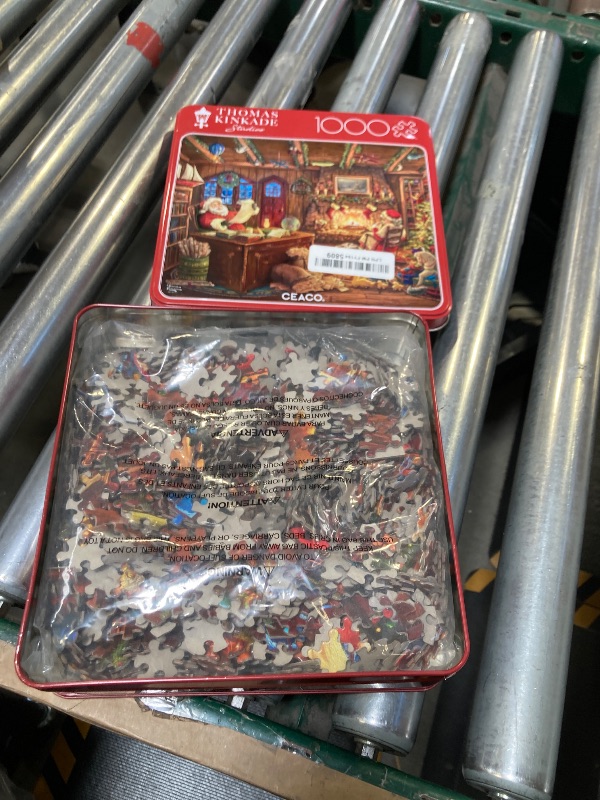 Photo 1 of Buffalo Games - Thomas Kinkade - Santa Checking His List - 1000 Piece Christmas Premium Collector’s Tin Jigsaw Puzzle - Festive, Holiday Puzzles for Adults – Winter Artwork, Relaxing Fun