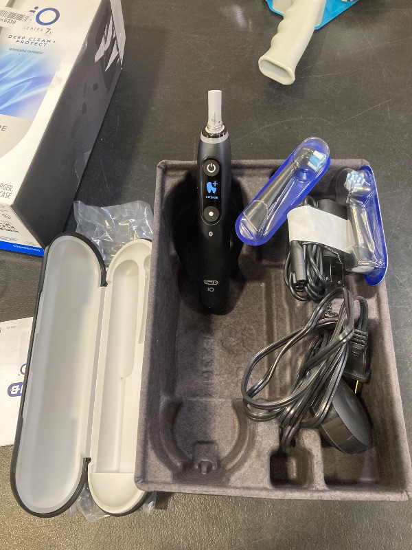 Photo 1 of Oral-B iO Deep Clean + Protect Rechargeable Electric Toothbrush, Black, iO Series 7, 2 Replacement Brush Heads, Charging Travel Case