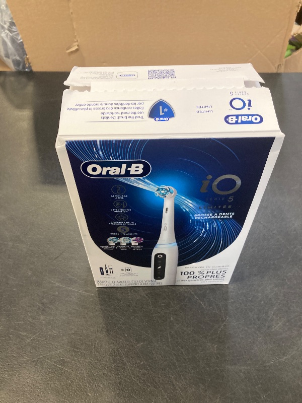 Photo 1 of Oral-B iO Deep Clean + Whiten Rechargeable Electric Toothbrush with Visible Pressure Sensor, 2 Minute Timer, 5 Cleaning Settings, 1 iO5 Limited, 3 Toothbrush Heads, Travel Case & Refill Holder, White