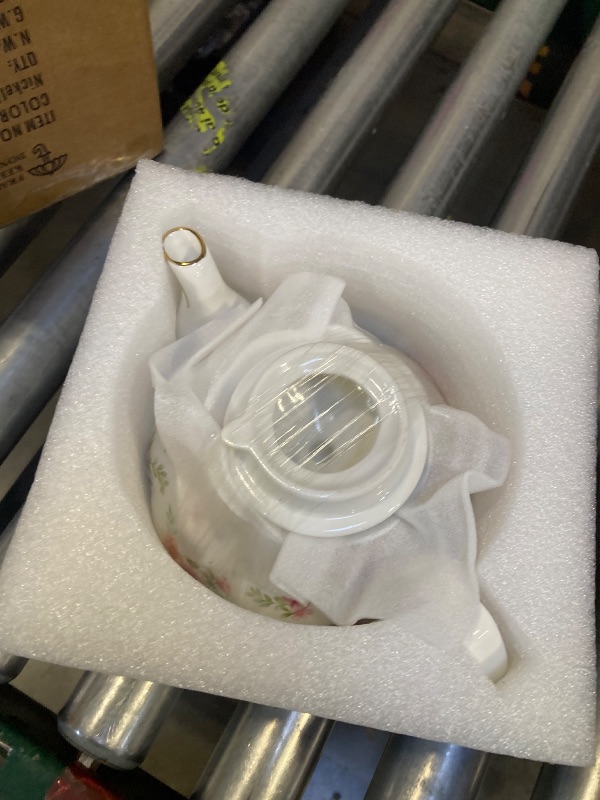 Photo 1 of Agyiuns Flower Ceramic Teapot,22oz Porcelain Tea pot for Tea Coffee Milk for Office Home Men Women as Gift(White and small flowers)