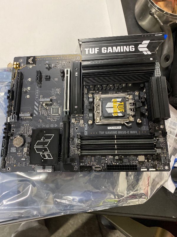 Photo 1 of ASUS TUF Gaming B850-E WiFi Motherboard Socket AMD AM5 (Ryzen 9000, PCIe 5.0, DDR5 Memory, WiFi 6E, PCIe Q-Release, BIOS Flashback, Aura Sync)