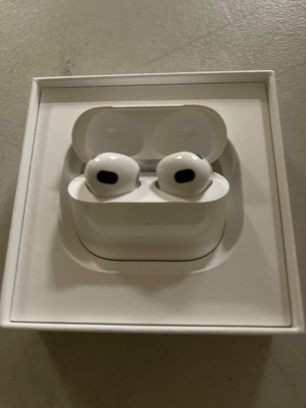 Photo 1 of Apple AirPods (3rd Generation) Wireless Ear Buds, Bluetooth Headphones, Personalized Spatial Audio, Sweat and Water Resistant, Lightning Charging Case Included, Up to 30 Hours of Battery Life