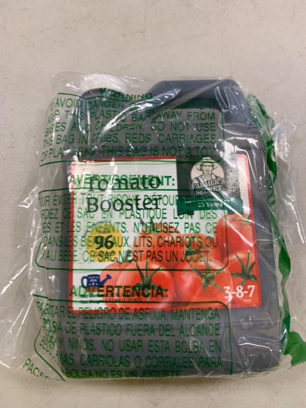 Photo 1 of Farmer's Secret Tomato Booster Fertilizer (32oz) - Super Concentrated - 3:8:7 Ratio Fortified with Humic Acid, Iron and Calcium - Grow More Tomatoes