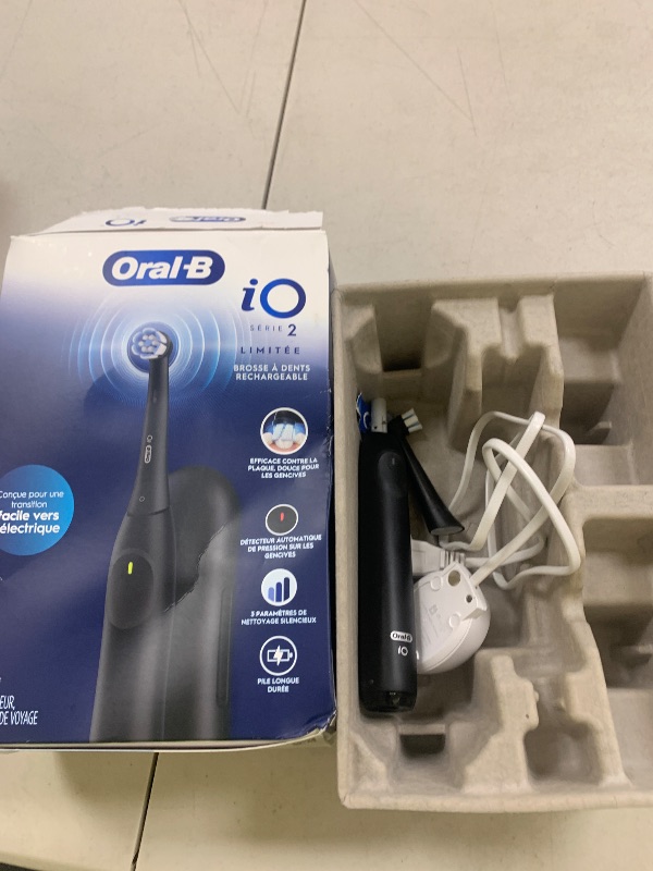Photo 1 of Oral-B iO Simple Clean Rechargeable Electric Powered Toothbrush, Night Black with 1 Gentle Care Brush Head and 1 Black Travel Case - Automatic Pressure Sensor to Protect Gums - 3 Modes - 2 Min Timer