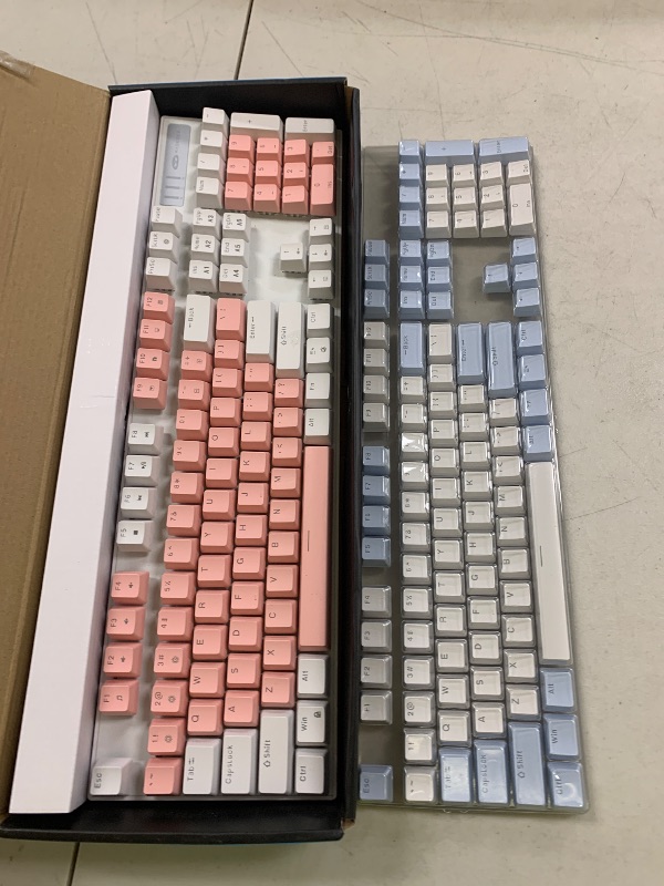 Photo 1 of MageGee Mechanical Gaming Keyboard, New Upgraded Blue Switch 104 Keys White Backlit Keyboards, USB Wired Mechanical Computer Keyboard for Laptop, Desktop, PC Gamers(White & Pink)