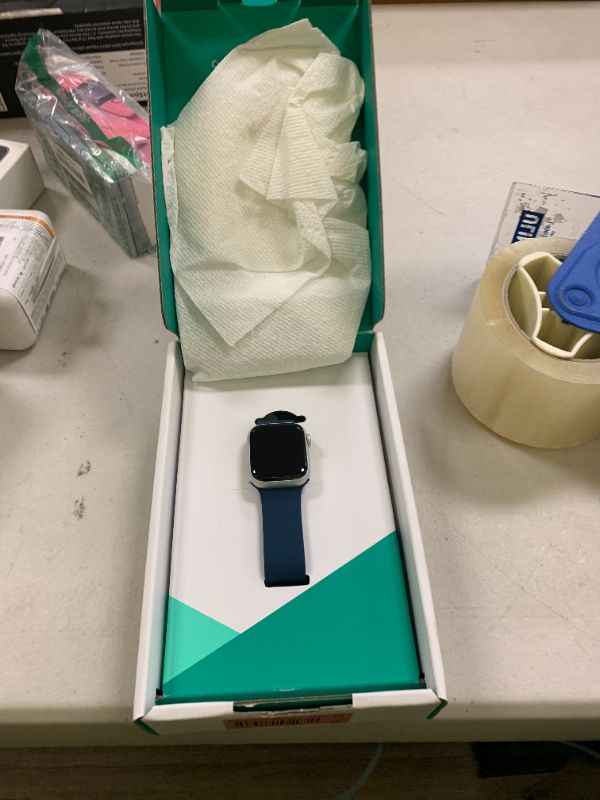 Photo 1 of Apple Watch Series 9 [GPS + Cellular 41mm] Silver Aluminum Case with Storm Blue Sport Band, S/M (Renewed Premium)