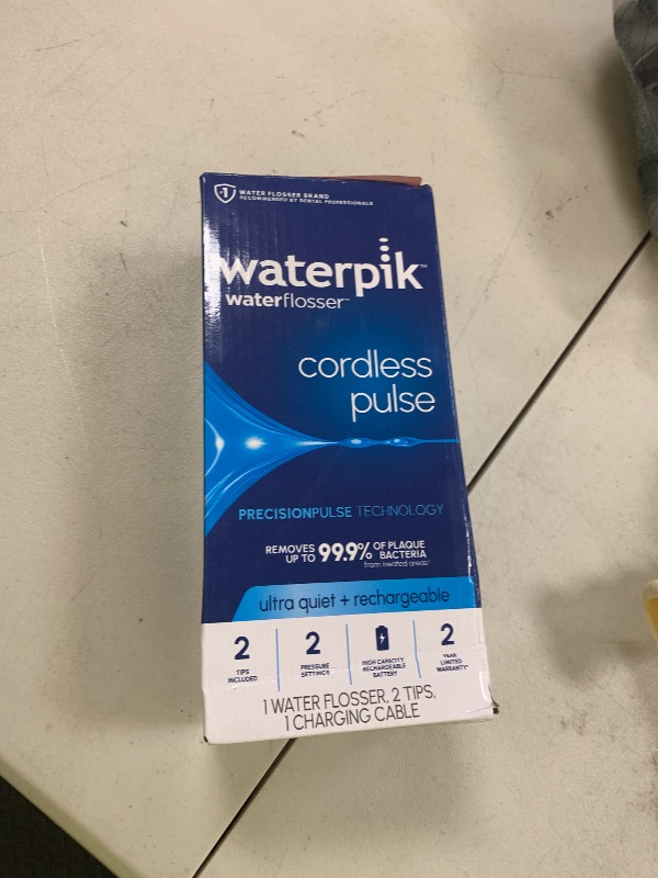 Photo 1 of Waterpik Cordless Pulse Rechargeable Portable Water Flosser for Teeth, Gums, Braces Care and Travel with 2 Flossing Tips, Waterproof, ADA Accepted, WF-20 White, Packaging May Vary