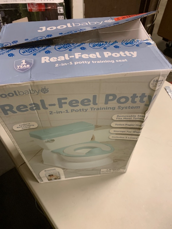 Photo 1 of Real Feel 2-in-1 Potty with Wipes Storage, Flushing Sounds & Disposable Liners - Realistic Toilet - Easy to Clean & Assemble - Jool Baby (Aqua)