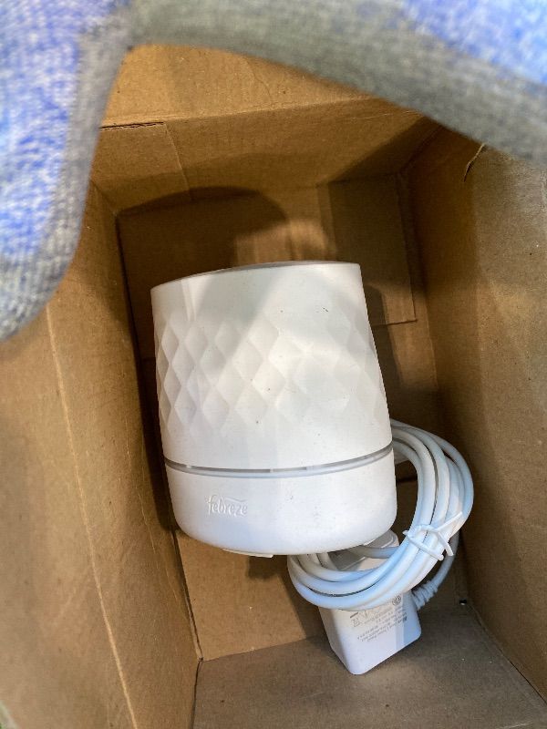 Photo 1 of ***MISSING REFILLS*** Febreze Plug Scent Booster Starter Kit, Oil Diffuser, Air Freshener Plug in, Giftable for Holidays, Continuous Scent Device + 2 Downy Calm Refills