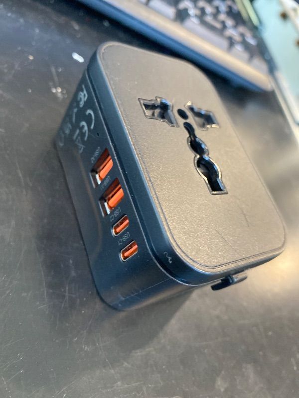 Photo 1 of ***READ CLERK NOTES*** Universal Travel Adapter, VYLEE 5 in 1 International Power Adapter, 3.5A 2xUSB-A and 2xUSB C Wall Charger, Worldwide Travel Essentials Plug for Europe USA UK AUS Asia (Black Grey)