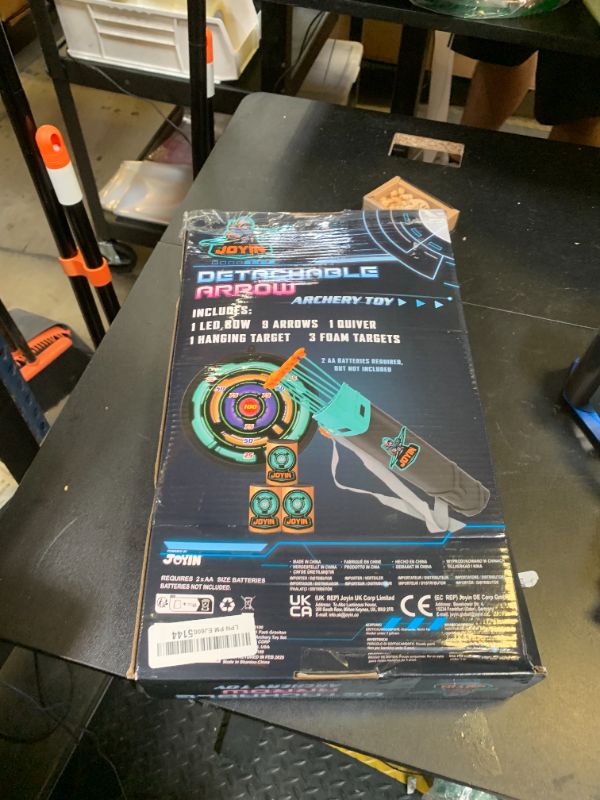 Photo 1 of JOYIN Kids Bow and Arrow Set, LED Light Up Archery Toy Set with 9 Suction Cup Arrows, Target & Arrow Case, Indoor and Outdoor Hunting Play Gift Toys for Kids, Boys & Girls Ages 6-12