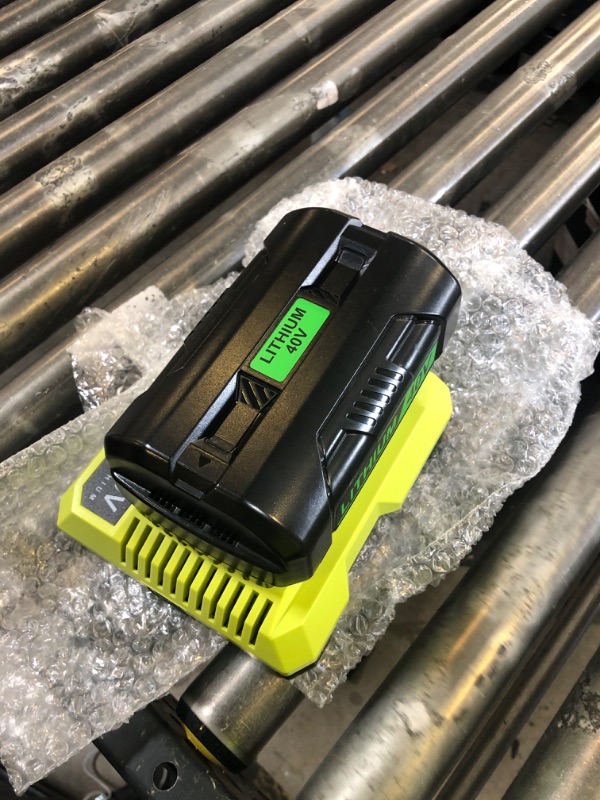 Photo 1 of Ryobi OP401 40V Battery Charger and Battery
