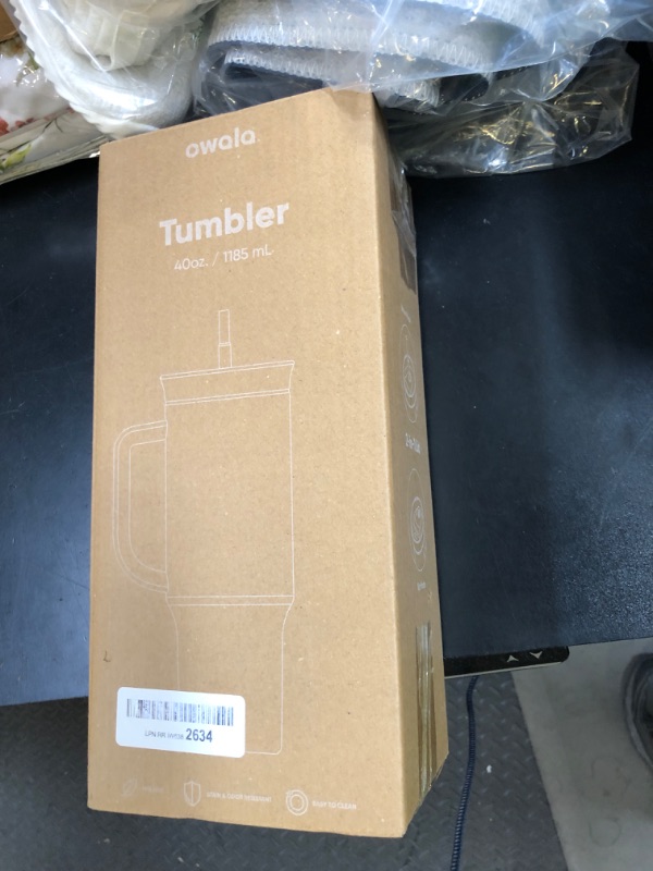 Photo 1 of Owala Stainless Steel Triple Layer Insulated Travel Tumbler with Spill Resistant Lid, Straw, and Carry Handle, BPA Free, 40 oz, Gray (Iced Tea)