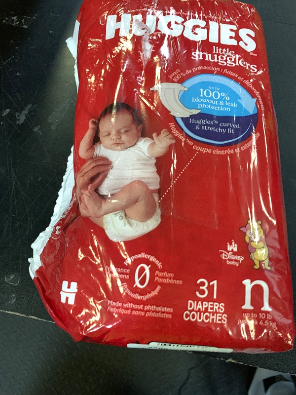 Photo 1 of Huggies Size Newborn Diapers, Little Snugglers Baby Diapers, Size Newborn (up to 10 lbs), 31 Count, Packaging May Vary