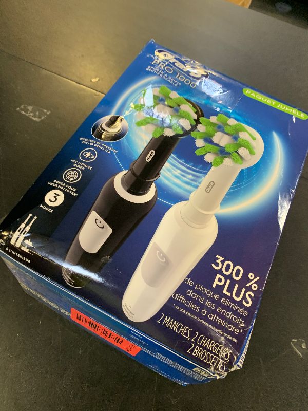 Photo 1 of Oral-B Pro 1000 CrossAction Electric Toothbrush, Black and White, 2 Count