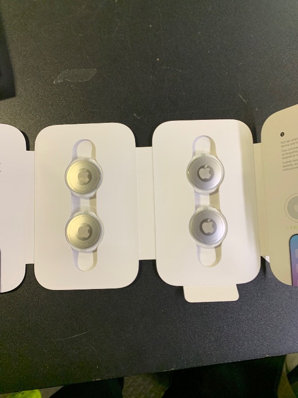 Photo 1 of Apple AirTag 4 Pack. Keep Track of and find Your Keys, Wallet, Luggage, Backpack, and More. Simple one-tap Set up with iPhone or iPad
