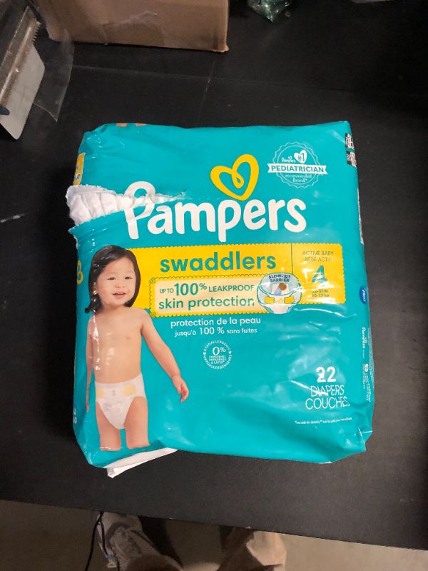 Photo 1 of Pampers Swaddlers Diapers, Size 4 (15-34 lbs), 22 Count, Absorbent, Keeps Baby Dry and Comfortable, Skin Safe Disposable Baby Diaper (Packaging May Vary)