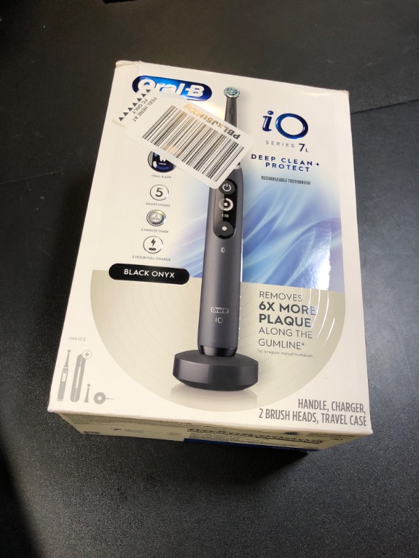 Photo 1 of Oral-B iO Deep Clean + Protect Rechargeable Electric Toothbrush, Black with a iO Series 7 Toothbrush, 2 Replacement Brush Heads, and a Charging Travel Case