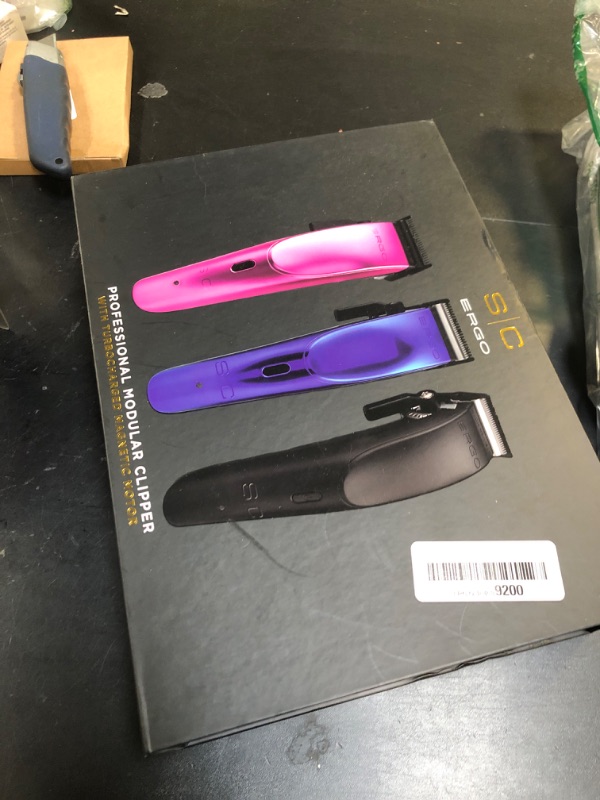 Photo 1 of StyleCraft Ergo Professional Microchipped Magnetic Clipper with 5 Guards, Charging Stand, and 3 Customizable Colored Lids (Black, Pink, Blue)