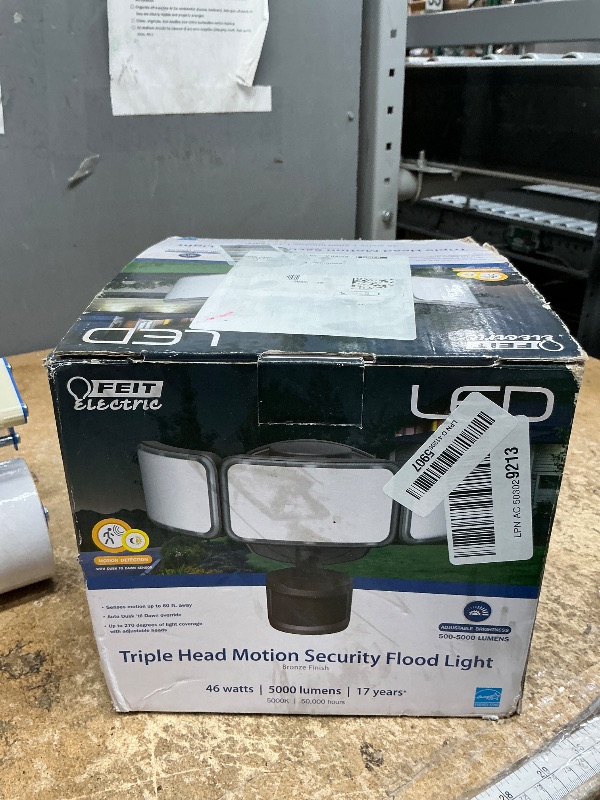 Photo 1 of ** missing hardware ** Feit Electric LED Security Light with Motion Sensor and Dusk to Dawn, Outdoor 46W Flood Light, Adjustable 3 Head, Wall Mount, 5000 Lumens, 5000k Daylight, Hardwired, Black S10.5TFL/850/MOT/BZ