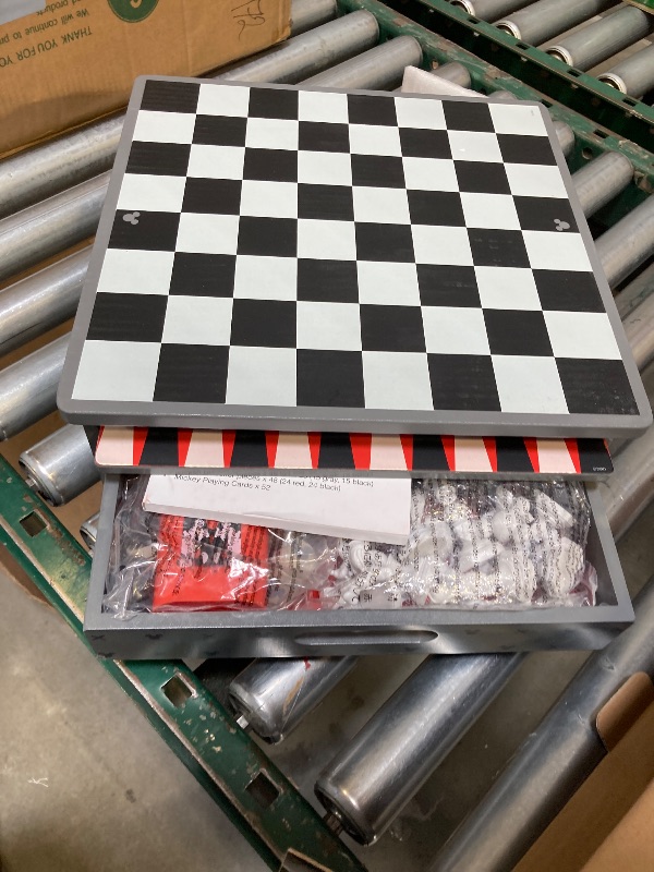 Photo 1 of  Disney Store Dolls & Games Mickey Mouse Deluxe Game Set - Includes Disney Chess Set, Checkers Pieces, Backgammon Board, Playing Cards, Poker Chips, Dice & Shaker Cup in Self-Contained Wooden Box 