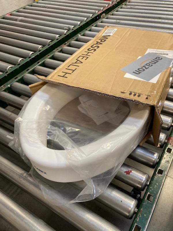 Photo 1 of Carex Toilet Seat Riser, Elongated Raised Toilet Seat Adds 3.5 inches to Toilet Height, for Assistance Bending or Sitting, 300 Pound Weight Capacity Toilet Riser