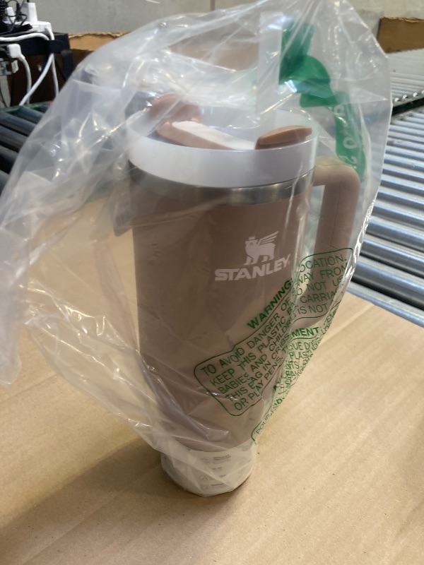 Photo 1 of STANLEY Quencher H2.0 Tumbler with Handle and Straw 40 oz | Flowstate 3-Position Lid | Cup Holder Compatible for Travel | Insulated Stainless Steel Cup | BPA-Free | Almond Rose