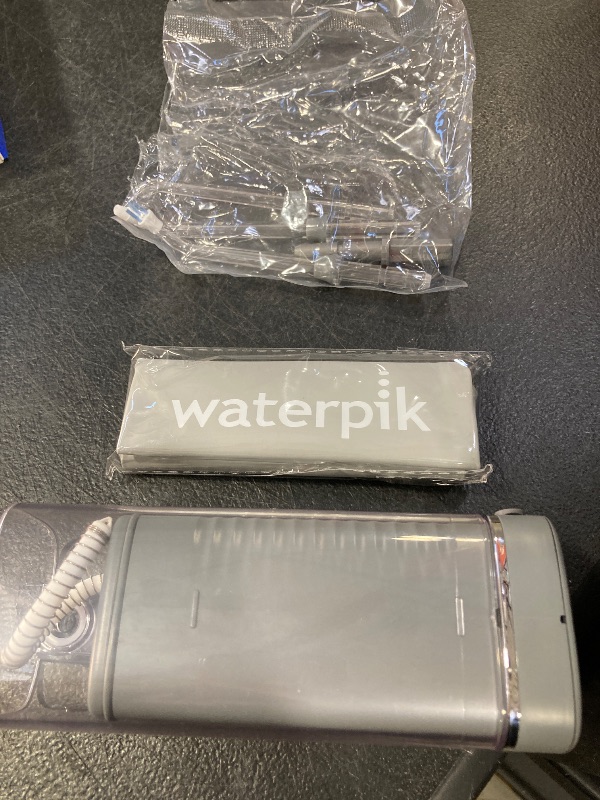 Photo 1 of Waterpik Cordless Slide Professional Water Flosser, Portable Collapsible for Travel and Storage, with Travel Bag and 4 Tips, ADA Accepted, Rechargeable and Waterproof, Modern Gray WF-17CD017-1