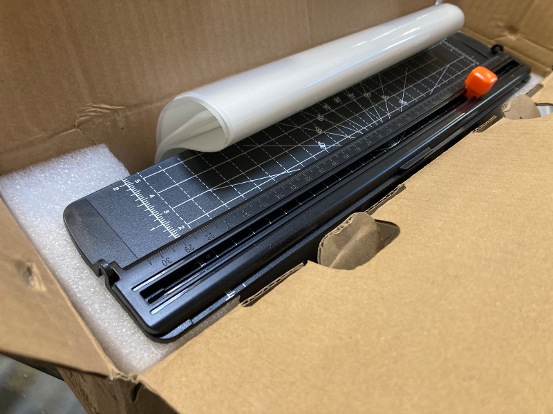 Photo 1 of 9-Inch 4-in-1 Thermal Laminator Machine with Never-Jam Tech, Includes 40 A4 Laminating Pouches, Trimmer & Corner Rounder for Office & Home Use - White