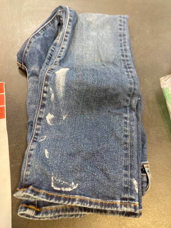 Photo 1 of Amazon Essentials Men's Straight-Fit Bootcut Jean - Discontinued Colors, Medium Wash, 34W x 32L has paint on it