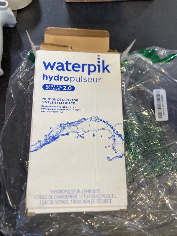 Photo 1 of Waterpik Cordless Advanced 2.0 Water Flosser For Teeth, Gums, Braces, Dental Care With Travel Bag and 4 Tips, ADA Accepted, Rechargeable, Portable, and Waterproof, White WP-580, Packaging May Vary