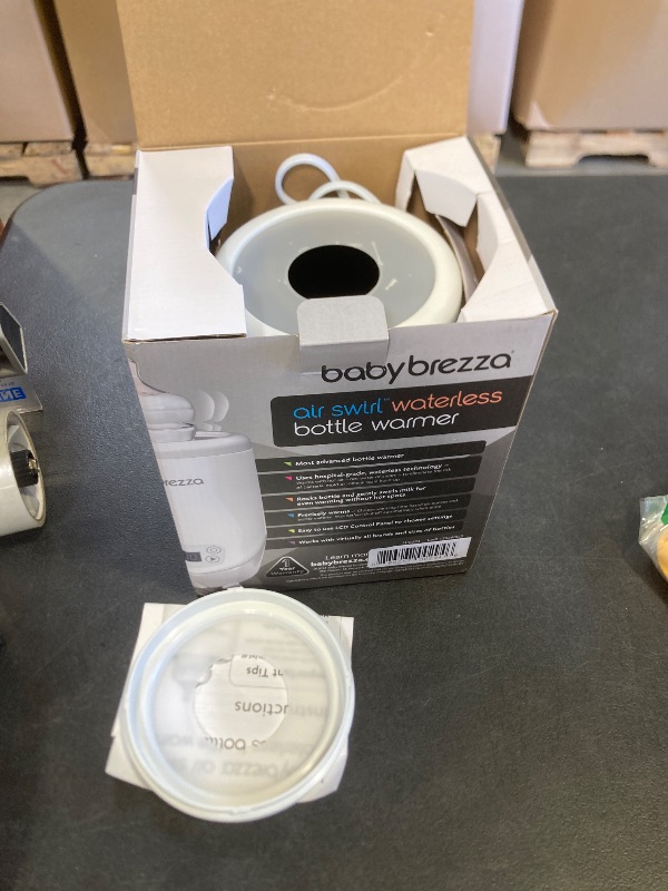 Photo 1 of Baby Brezza AirSwirl Waterless Baby Bottle Warmer - Safely Warm Breastmilk + Formula - Bottles Stay Dry + Nutrients are Protected - Works with Nearly All Bottles