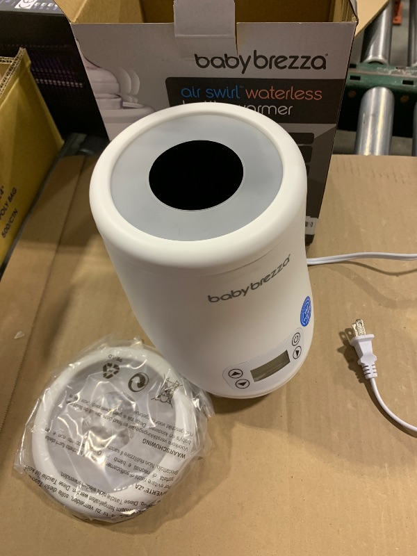Photo 1 of Baby Brezza AirSwirl Waterless Baby Bottle Warmer - Safely Warm Breastmilk + Formula - Bottles Stay Dry + Nutrients are Protected - Works with Nearly All Bottles