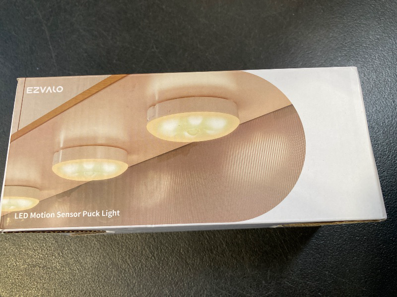 Photo 1 of EZVALO Under Cabinet Lighting,1000mAh Rechargeable Puck Lights with Remote,3 Color Temps & 12 RGB Motion Sensor Closet Lights Indoor, Dimmable Under Counter Lights for Kitchen, Shelf Black (6 Packs)