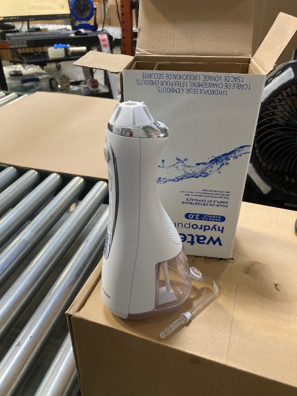 Photo 1 of Waterpik Cordless Advanced 2.0 Water Flosser For Teeth, Gums, Braces, Dental Care With Travel Bag and 4 Tips, ADA Accepted, Rechargeable, Portable, and Waterproof, White WP-580, Packaging May Vary