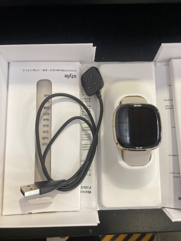 Photo 1 of Fitbit Sense Advanced Smartwatch with Tools for Heart Health, Stress Management & Skin Temperature Trends, White/Gold, One Size (S & L Bands Included)