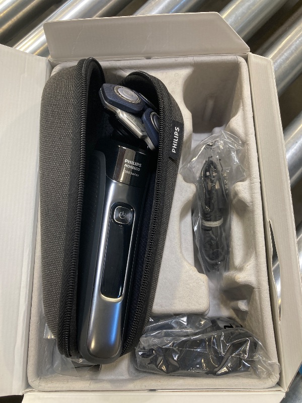 Photo 1 of Philips Norelco Shaver 7300, Rechargeable Wet & Dry Electric Shaver with SenseIQ Technology, Pop-up Trimmer, Charging Stand, Click-on Nose Trimmer, & Travel Case, S7887/92