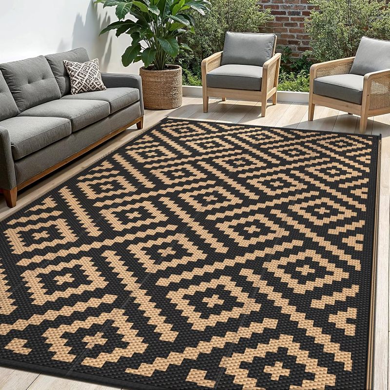 Photo 1 of Outdoor Rug for Patio - Waterproof Plastic Straw Camping Rugs 10x14 ft, Reversible Outdoor Indoor RV Mat Carpet for Patio, Porch, Deck, Balcony, Picnic, Beach, Black Brown
