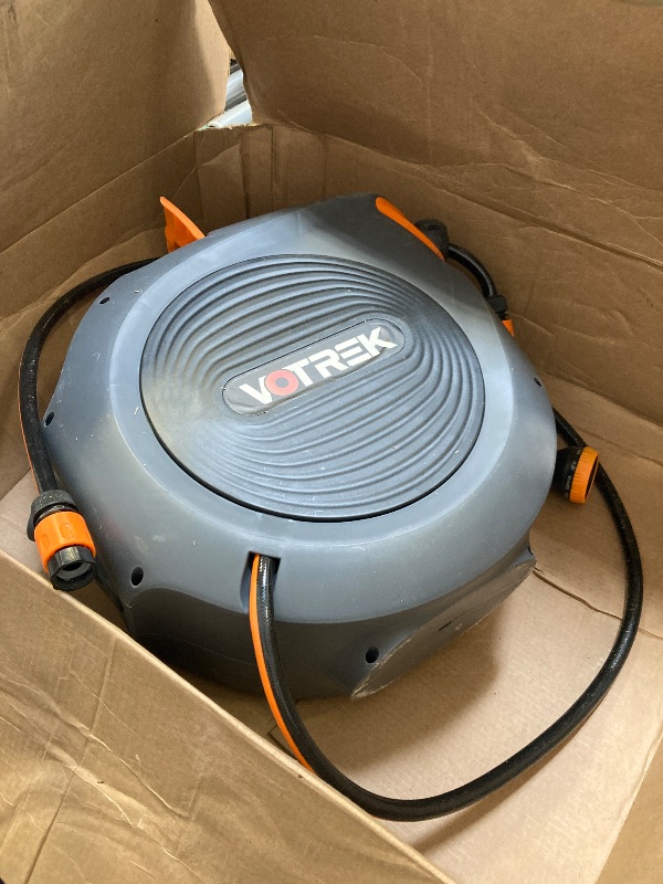 Photo 1 of Retractable Garden Hose Reel Outside [1/2 inch ×100 FT], VOTREK Automatic Rewind Wall Mounted Hose Reel [Heavy Duty] with Any Length Lock, 180° Swivel Bracket, 9 Modes Nozzle for Watering Cleaning
