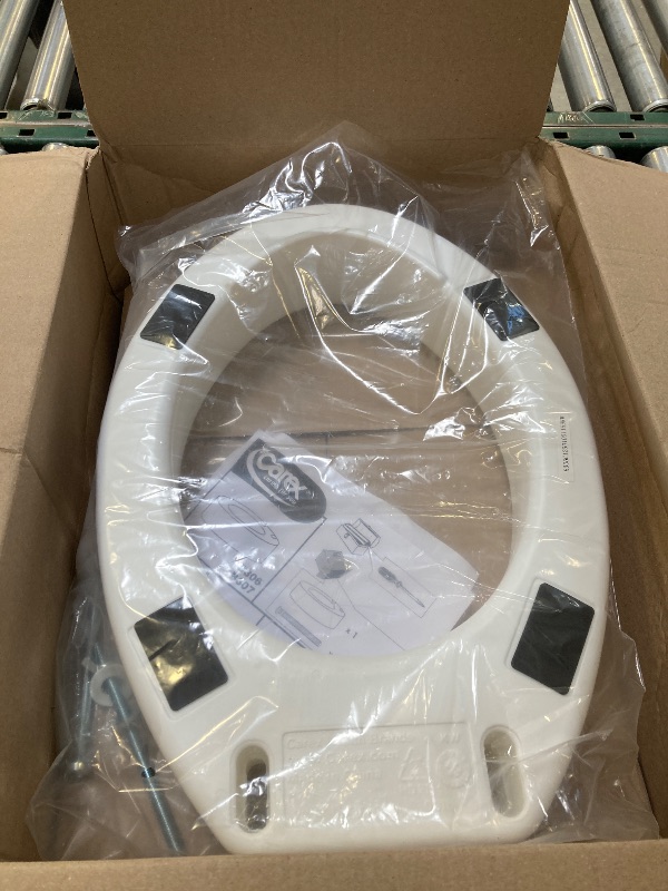 Photo 1 of Carex Elongated Hinged Toilet Seat Riser, Adds 3.5 Inches of Height to Toilet, 300 Pound Weight Capacity, Raised Toilet Seat
