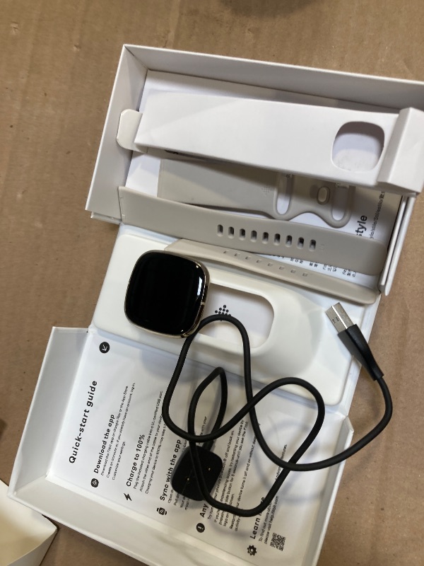 Photo 1 of Fitbit Sense Advanced Smartwatch with Tools for Heart Health, Stress Management & Skin Temperature Trends, White/Gold, One Size (S & L Bands Included)