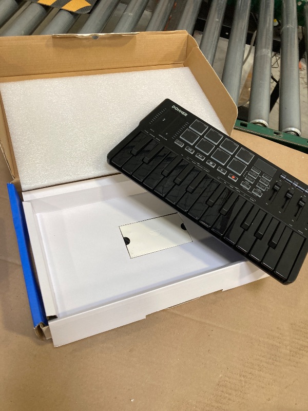 Photo 1 of Donner USB-C MIDI Keyboard Controller, 25 Key Portable Mini MIDI Keyboard with 8 Drum Pads, OLED Display, 16 Smart Scales, Arpeggio, Replay, 4 DAW Software and 40 Teaching Courses, DMK 25 Pro Black