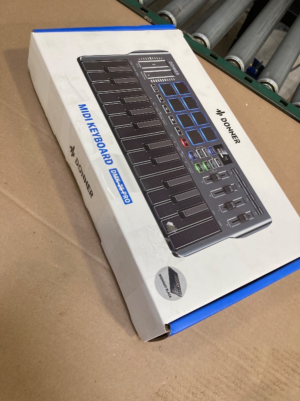 Photo 1 of Donner USB-C MIDI Keyboard Controller, 25 Key Portable Mini MIDI Keyboard with 8 Drum Pads, OLED Display, 16 Smart Scales, Arpeggio, Replay, 4 DAW Software and 40 Teaching Courses, DMK 25 Pro Black