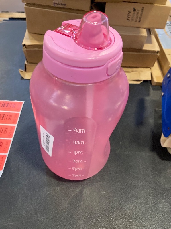 Photo 1 of Ello Hydra 64oz Half Gallon Water Jug with Handle and Motivational Time Markers for All Day Hydration, Plastic Reusable Water Bottle with Straw and Locking, Leak Proof Lid, BPA Free, Bubblegum