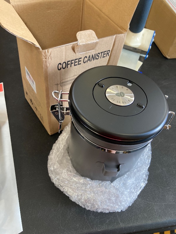 Photo 1 of HAIOOU Airtight Coffee Canister, 22OZ Large Stainless Steel Coffee Bean Storage Container with Date Tracker, Measuring Scoop, CO2 Releasing Valves and Mini Tongs for Beans, Grounds and more - Gray