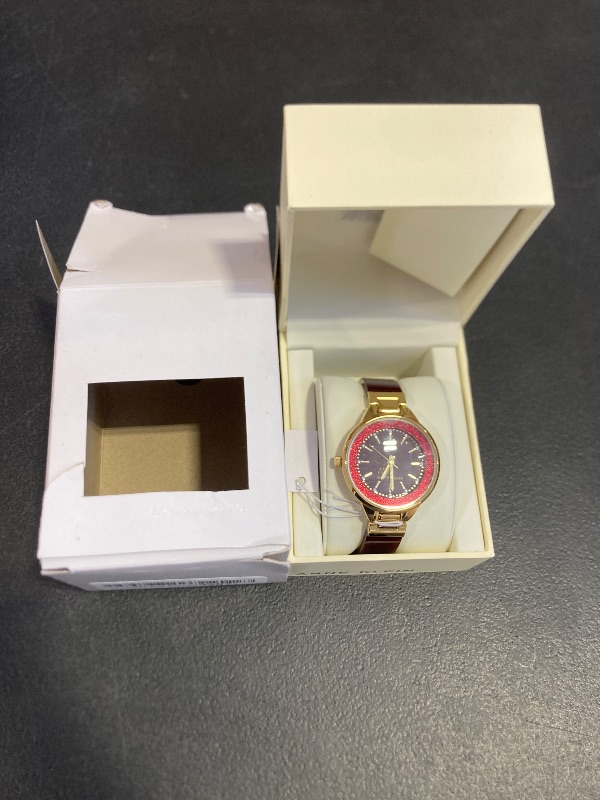 Photo 1 of Anne Klein Women's AK/1408BYBY Premium Crystal Accented Gold-Tone and Burgundy Shimmer Resin Bangle Watch