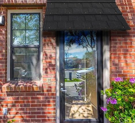 Photo 1 of Fixed Metal Awnings 52in W x 31in H, Heavy-Duty Triangle Steel Frame with Tile-Design Metal Awning for Doors, Windows, Porches, Balconies (Black)