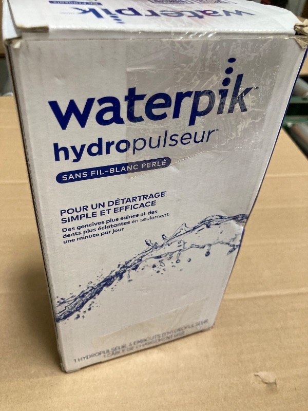 Photo 1 of Waterpik Cordless Pearl Rechargeable Portable Water Flosser for Teeth, Gums, Braces Care and Travel with 4 Flossing Tips - ADA Accepted, WF-13 White, Packaging May Vary